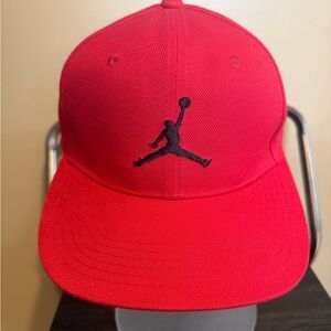 Air Jordan youth snapback hat in bright red with black Jumpman logo.